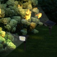 Solar garden stake LED light in garden landscape scene